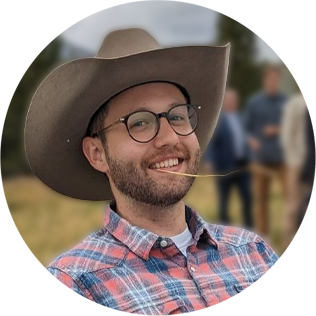 White man wearing a cowboy hat and glasses