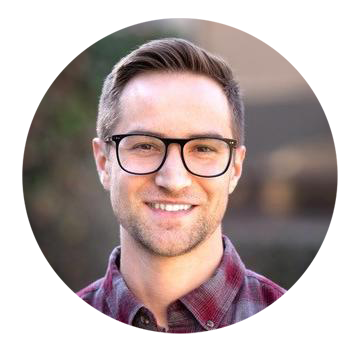 White man with short, light brown hair and wearing glasses