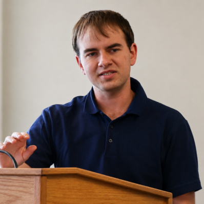 Picture of a young white man with a blue shirt.